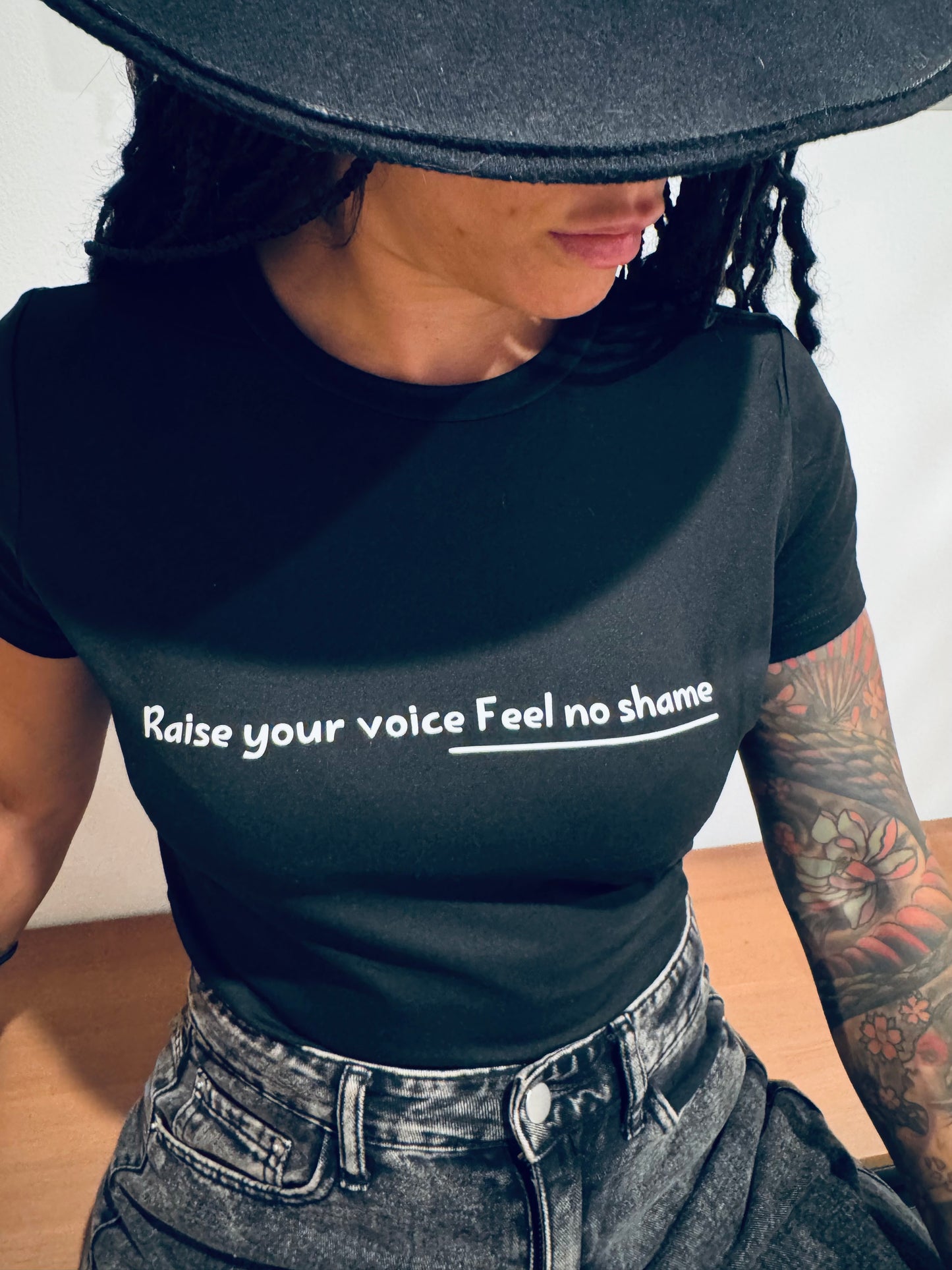 Black T-shirt: Raise your voice feel no shame - Bala Hdoud